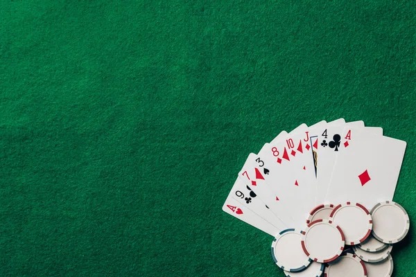 AduQ table interface on a smartphone showing bet buttons, live dealer feed, and player chat